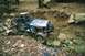1976 Ford Bronco - This custom off-road buggy is navigating a challenging, rocky terrain with steep inclines.
