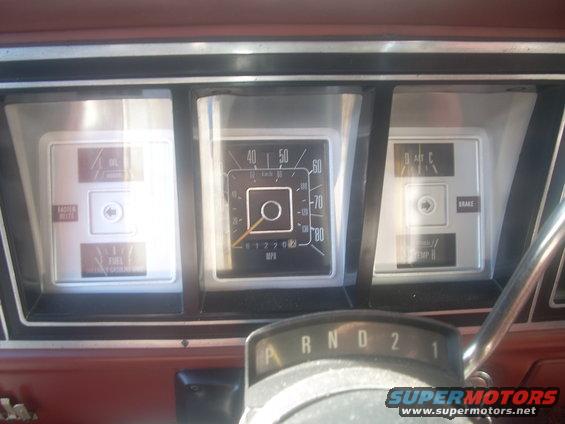 Dashboard with oil, fuel, temperature, and brake gauges; speedometer reads 0 mph