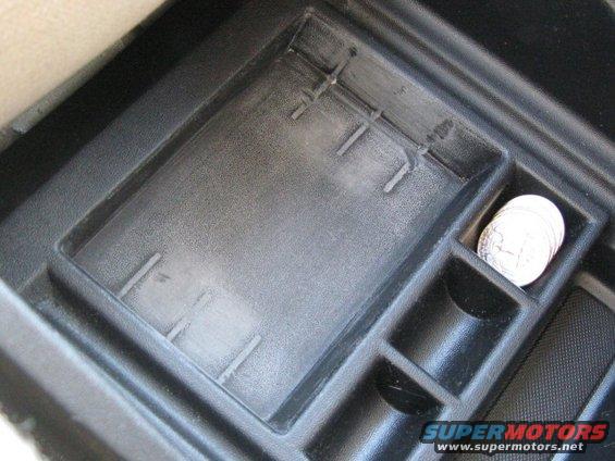 console_bin.jpg Removed tabs from cassette holder to make a large bin.
