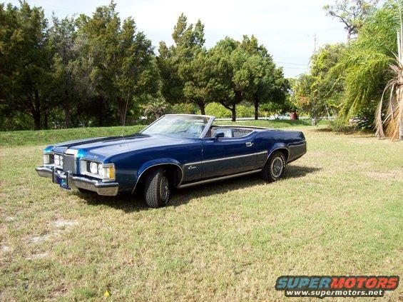 Blue 1973 Mercury Cougar convertible parked on grass