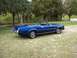 1973 Mercury Cougar - Blue 1973 Mercury Cougar convertible parked outdoors on a grassy area.