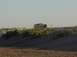 1992 Ford Bronco - A 1992 Ford Bronco navigates a dusty, arid landscape.