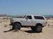 1992 Ford Bronco - This 1992 Ford Bronco is parked on a sandy terrain near the coast.
