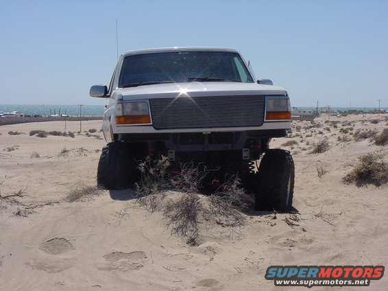 1992 Ford Bronco front view, lifted, on sand