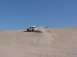 1992 Ford Bronco - White 1992 Ford Bronco driving on a sand dune.