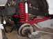 1992 Ford Bronco - Custom red suspension components, including coilover shocks and control arms, are visible on a vehicle's undercarriage.