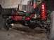 1992 Ford Bronco - Vehicle suspension components, including red coil springs and black differential housing.
