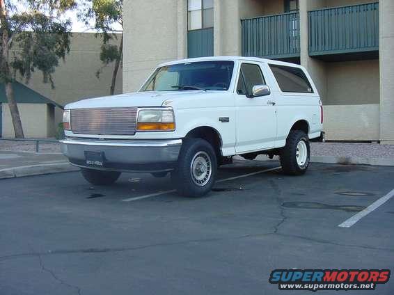 White 1992 Ford Bronco parked in a lot, front 3/4 view