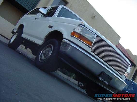 White 1992 Ford Bronco 3/4 front view with chrome grille