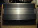 1992 Ford Crown Victoria - A car audio amplifier with the "Massive" logo is shown on a wooden surface.
