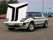 1983 Mazda RX-7 - This white Mazda RX-7 features distinctive black racing stripes on the hood and sides.