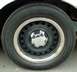 1999 Ford Crown Victoria - This photo shows a steel wheel with a chrome trim ring and a Ford center cap, not a full vehicle.