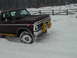 1979 Ford Bronco - Ford Bronco with brush guard navigating a snowy landscape.