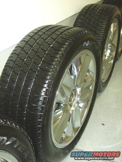 Four chrome wheels with Goodyear tires lined up