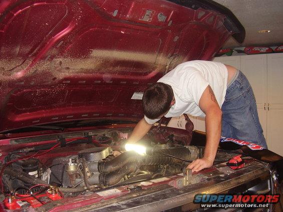 Me pulling the old spark plug wires.