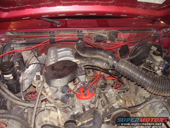 1994 Ford Bronco engine bay with red paint and visible engine components