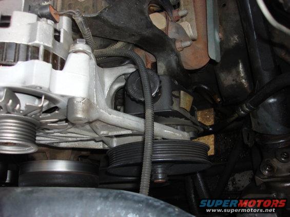 powersteering7.jpg ok-it was geting cold fast and dark so i speed thru this. disconnect the return lines. i placed a drain pan below the pump then remove the pulley so you can remove the 3 front bolts.