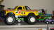 1979 Ford Bronco - Multiple toy trucks are displayed on a shelf, including a yellow monster truck.