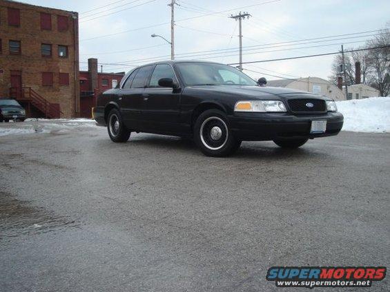 Black 2000 Ford Crown Victoria, 3/4 front view