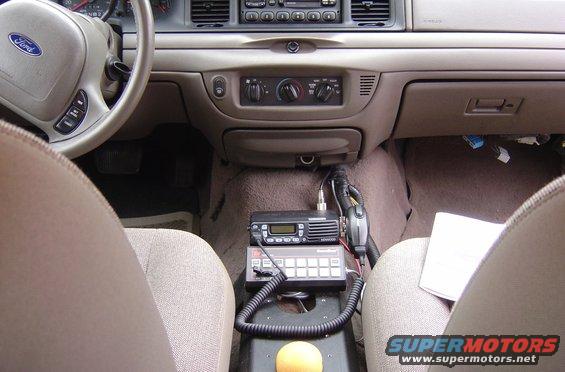 2003 Ford Crown Victoria interior showing dashboard, steering wheel, center console with radio equipment, and seats