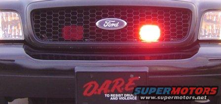 2003 Ford Crown Victoria front grille with red light and D.A.R.E. plate