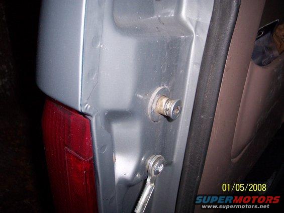 Tailgate latch mechanism with visible date stamp