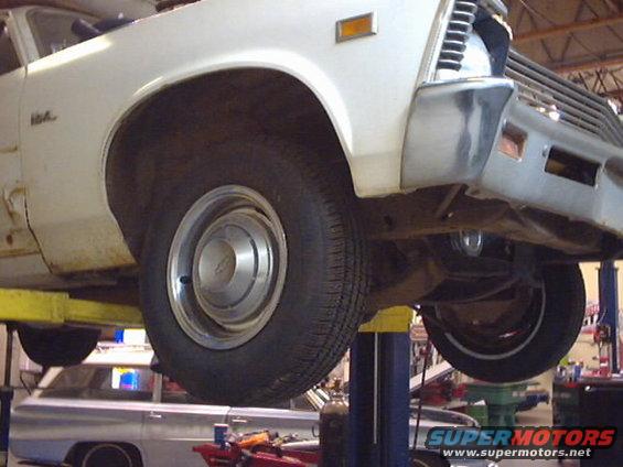 1969 Chevrolet Nova on lift, front quarter view, white exterior