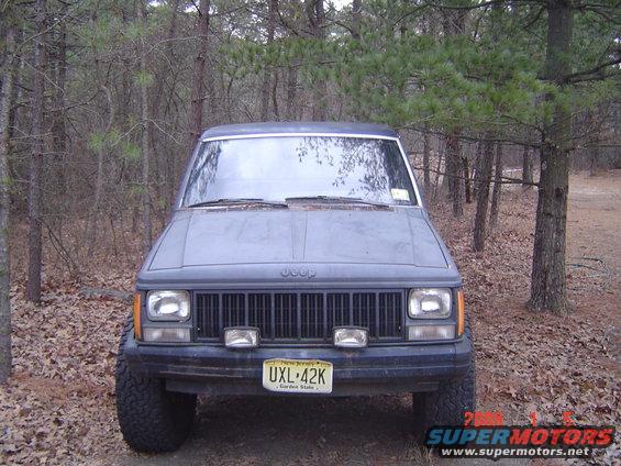 1988 Jeep Comanche front view in wooded area. License plate UXL-42K