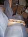 1984 Ford Bronco II - The interior of the vehicle features cloth seats and a custom wooden center console with cup holders and storage.