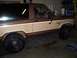 1984 Ford Bronco II - Side view of a 1984 Ford Bronco II, showing its distinctive two-tone brown and tan paint scheme.