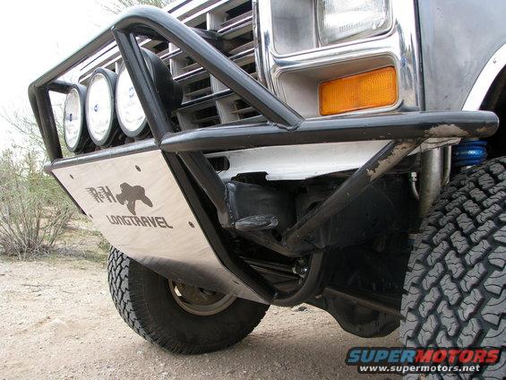 Front view of a 1980 Ford Bronco with a custom off-road bumper and lights