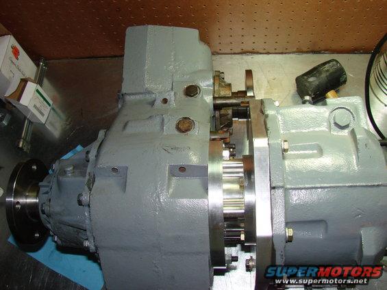 Gray NP203/205 doubler transfer case with silver adapter plate and visible gears