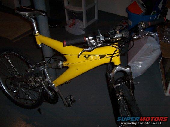 Yellow YBE bicycle frame and handlebars