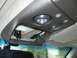 1994 Chevrolet Silverado 3500 - The interior overhead console shows exposed wiring and a light fixture, with a rearview mirror visible below.