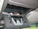 1994 Chevrolet Silverado 3500 - The open overhead console compartment reveals wiring and the internal latch mechanism.