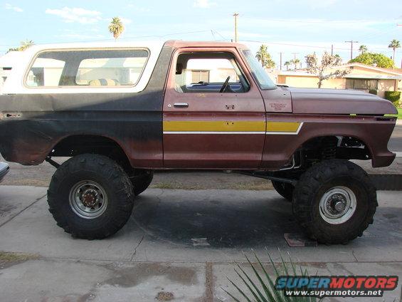 Lifted 1978 Ford Bronco with two-tone paint and large off-road tires