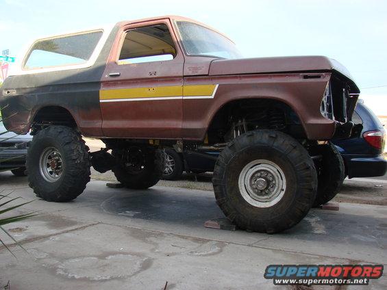 Lifted 1978 Ford Bronco with large tires and custom paint job