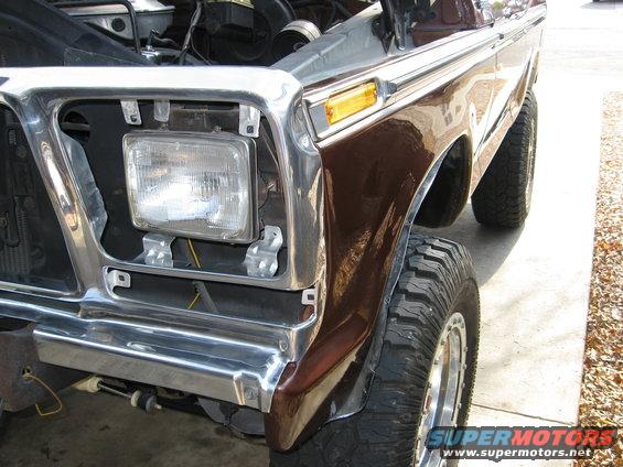 Brown 1979 Ford Bronco front fender and headlight assembly with chrome trim