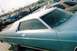 1973 Mercury Monterey - A light blue 1973 Mercury Monterey two-door hardtop with a white vinyl roof is parked in a lot with other vehicles.