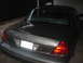 2000 Ford Crown Victoria - The rear of a 2000 Ford Crown Victoria shows its taillights and license plate.