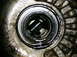 1995 Ford Probe - Close-up of a greasy mechanical component, likely from an engine or transmission.