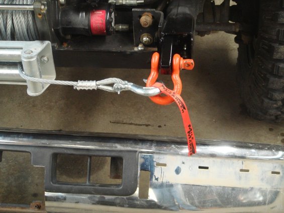1996 Ford Bronco front bumper with winch and orange tow strap attached