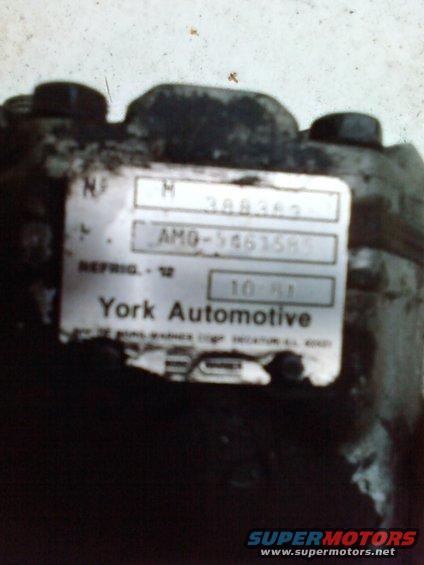 York Automotive air conditioning compressor with label showing part number AMO-5461585 and date 10-91