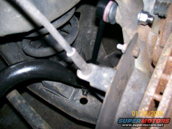 Close-up of a car's front sway bar linkage with a date stamp of 01/08/2008