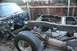 1991 Ford Bronco - The chassis of a 1991 Ford Bronco is visible, with the front end partially dismantled and the engine bay exposed.