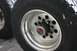 1991 Ford Bronco - The image shows a close-up view of heavy-duty truck wheels and tires, with visible tire brand markings.