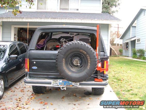 dscf1444.jpg Farm jack mounted with 2 ubolts, one bandana and a bike lock.
Also notice the shackle on the bumper, that plate it is going through is bolted to the frame AND bumper. 
Also got the spair 35 thanks to FSBs canuckin.
And the CB anteana is magnetic mount, but after droping it offroad I added a c-clamp behind the bumper to hold it on tight.