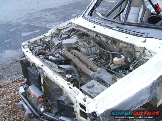 1995 Ford Bronco engine bay with winch and roll cage