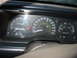 1993 Ford Taurus - Interior view of a car's dashboard, a speedometer, tachometer, fuel, and temperature gauges.