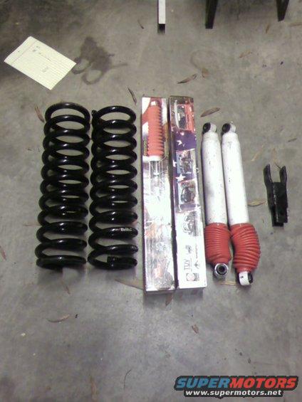 Coil springs and shock absorbers with red boots and boxes